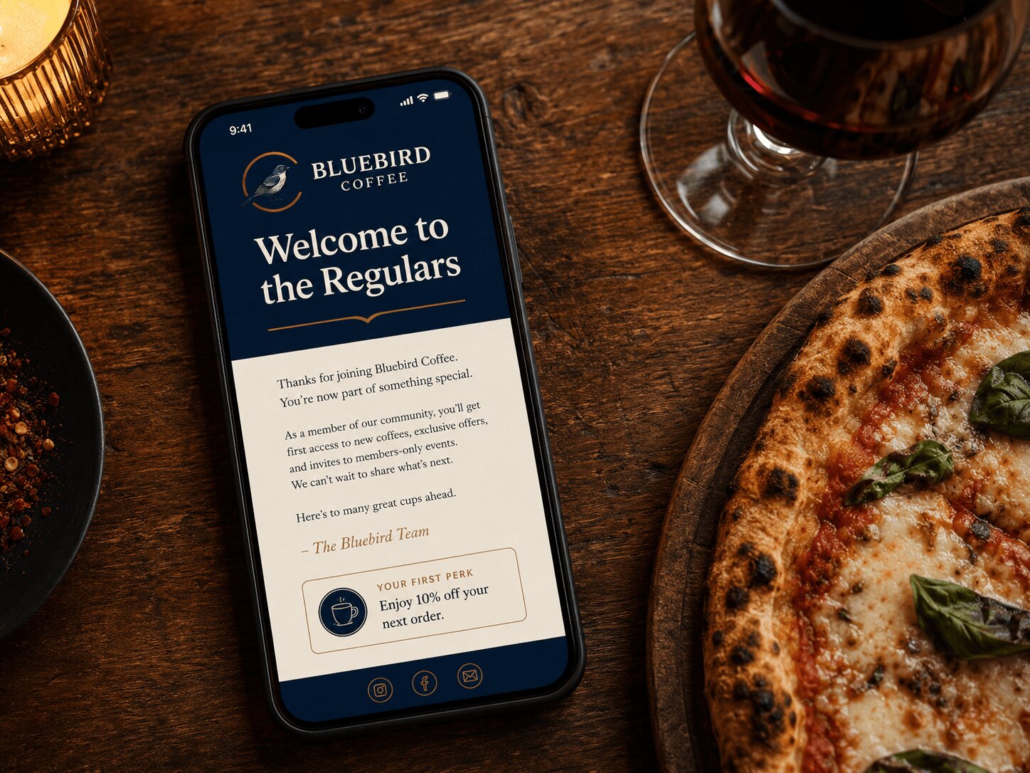 Bluebird Coffee welcome email on phone